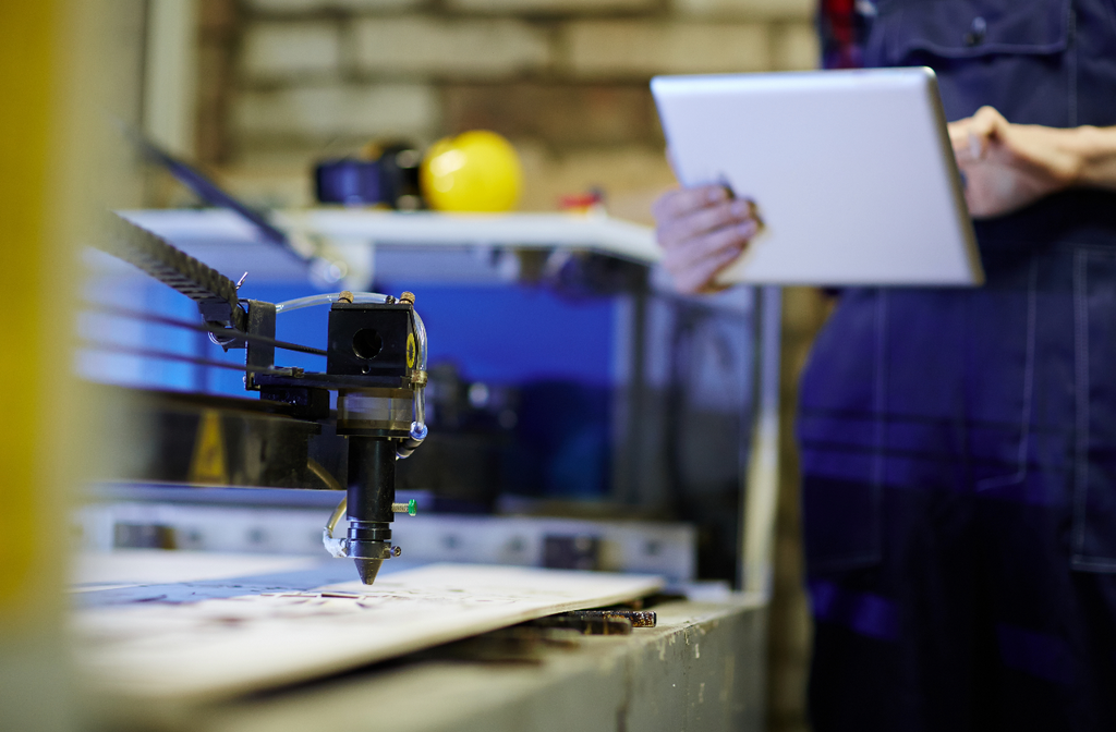 A laser engraver programs the laser engraving machine.