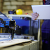 A laser engraver programs the laser engraving machine. 