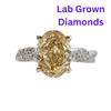 14kt Two Toned 4.07ct Oval Lab Grown Yellow Oval Diamond and .46ctw Lab Twist Ring