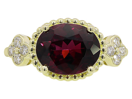 14K YG 3.37CT OVAL GARNET .22C